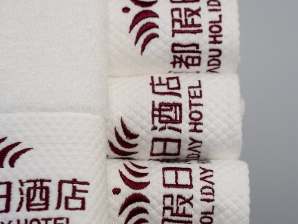 White and platinum embroidered Holiday Inn 100% cotton towel