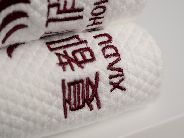 White and platinum embroidered Holiday Inn 100% cotton towel