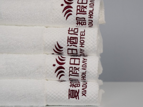 White and platinum embroidered Holiday Inn 100% cotton towel