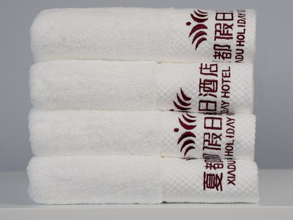 White and platinum embroidered Holiday Inn 100% cotton towel
