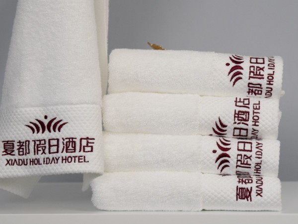 White and platinum embroidered Holiday Inn 100% cotton towel